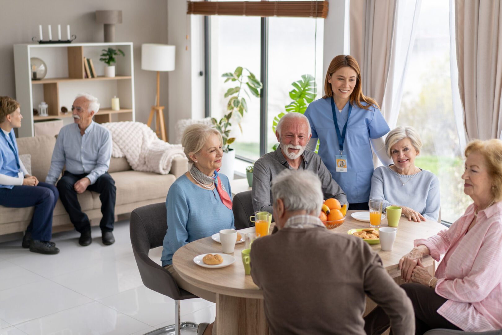 Elderly people socializing in a care home.
